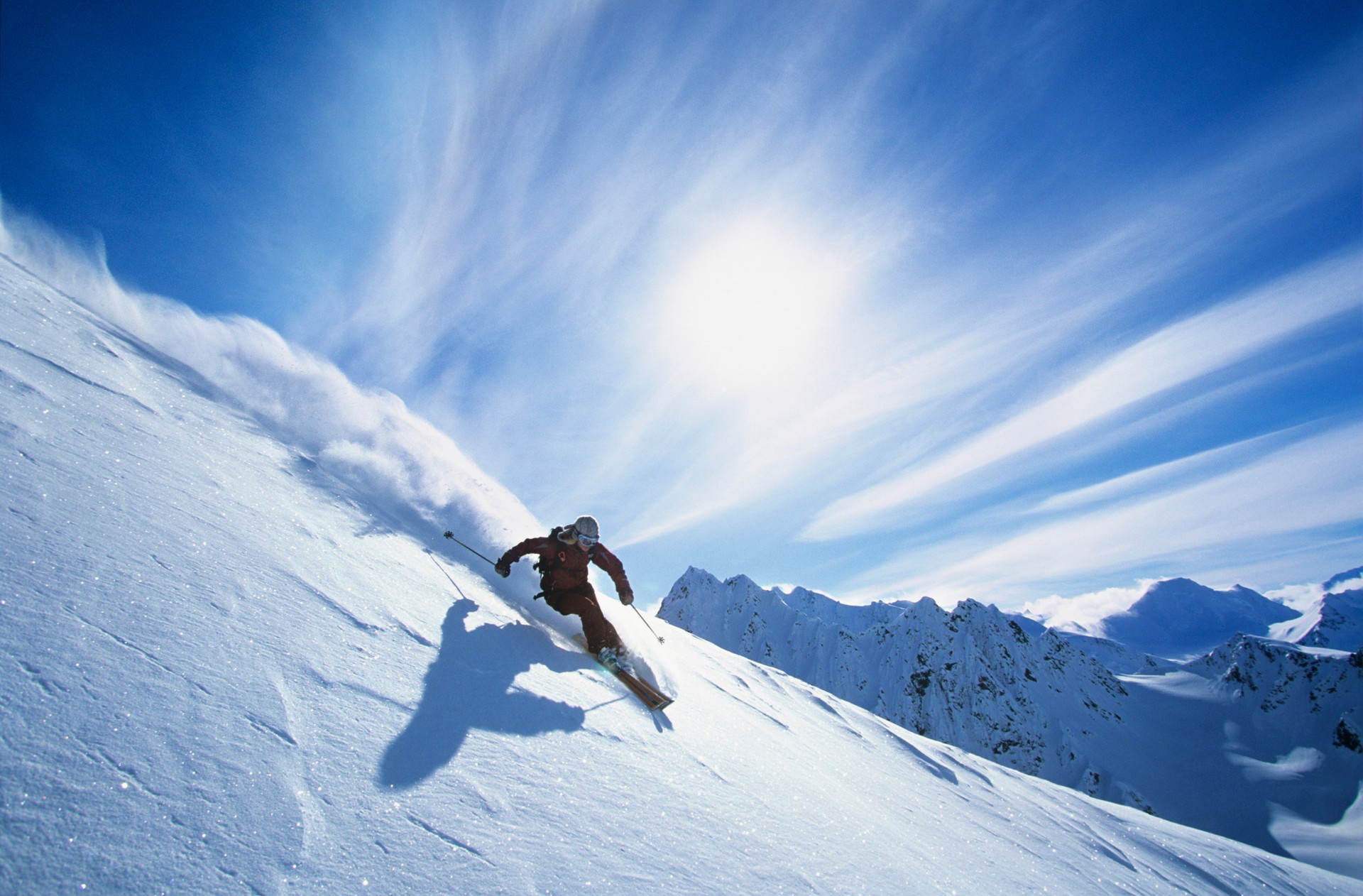 Skier Skiing On Mountain Slope